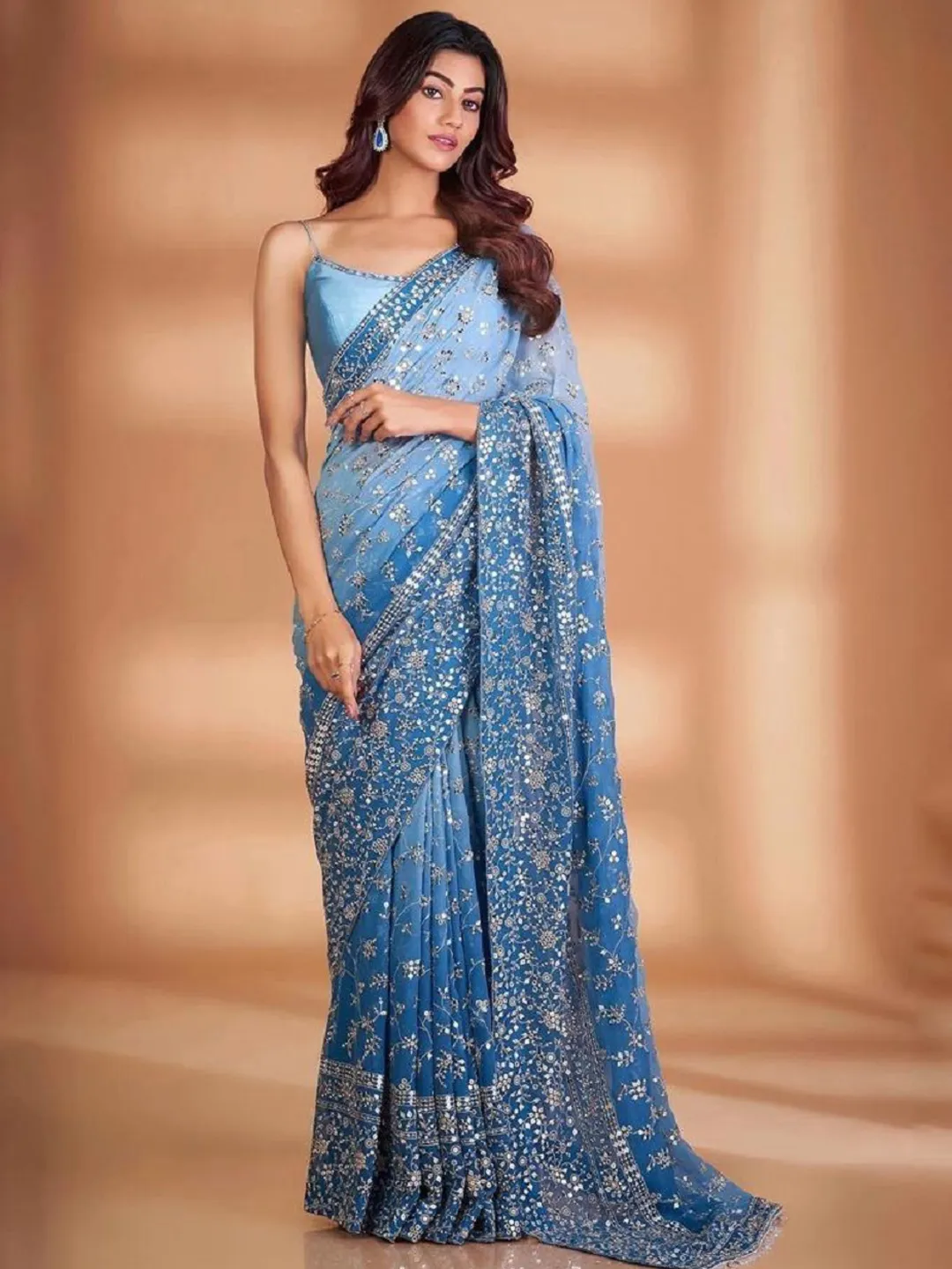  Weddings Saree Designs Elegant georgette party wears a saree with intricate detailing and a modern drape.