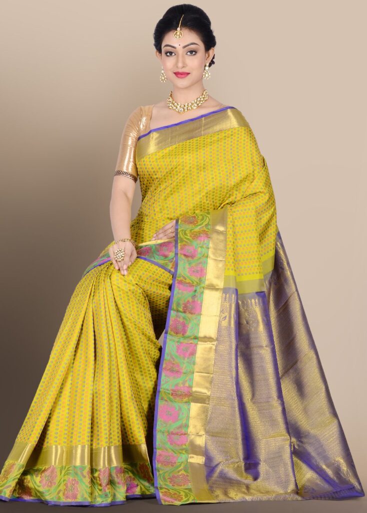 A vibrant lime green Tusar silk saree adorned with delicate floral prints, offering a fresh and elegant look perfect for festive or casual occasions.