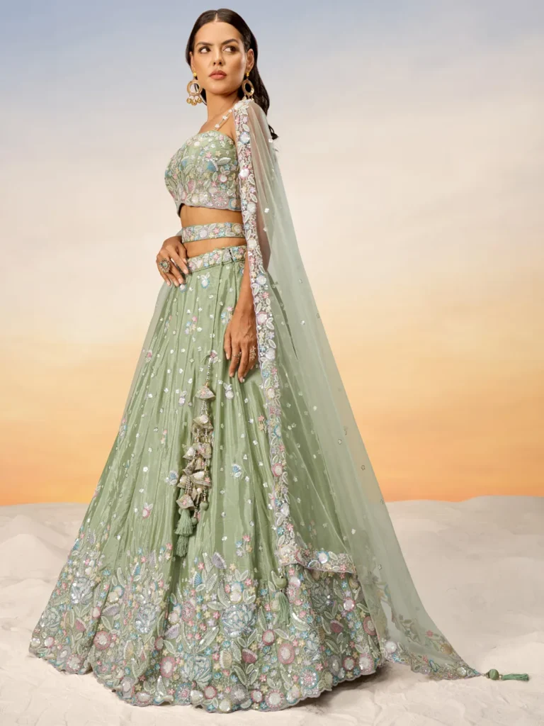 A chiffon bridal lehenga featuring delicate embroidery and intricate detailing, perfect for a graceful, elegant wedding look.