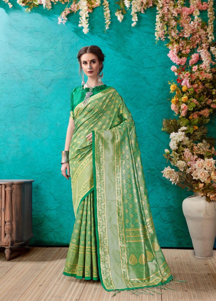 Greenish blue Kora Banarasi silk saree with delicate traditional patterns and intricate zari work, offering an elegant and timeless appeal for festive occasions.