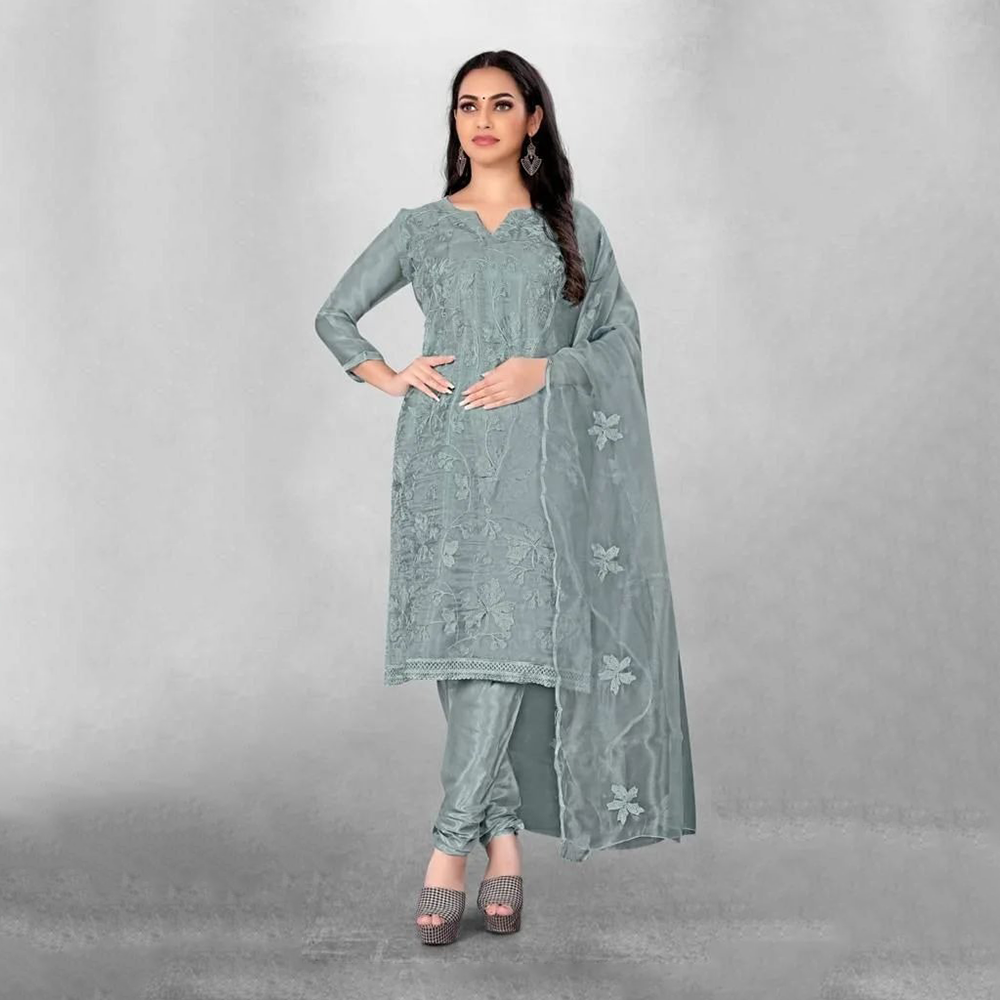 A delicate and elegant Tissue Salwar Kameez set featuring a light, airy fabric with subtle sheen. Paired with a traditional Kota dupatta, 