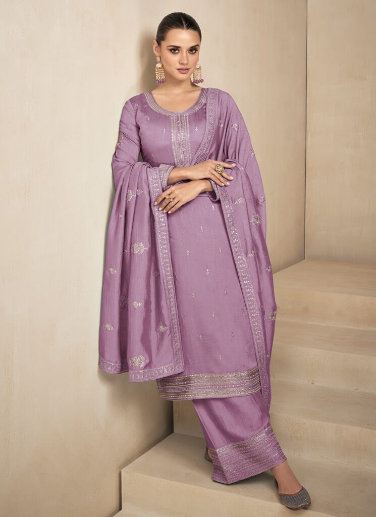 A graceful lavender Chandri silk cotton salwar set adorned with intricate neck embroidery, offering a perfect blend of elegance and comfort. Ideal for festive and casual occasions.