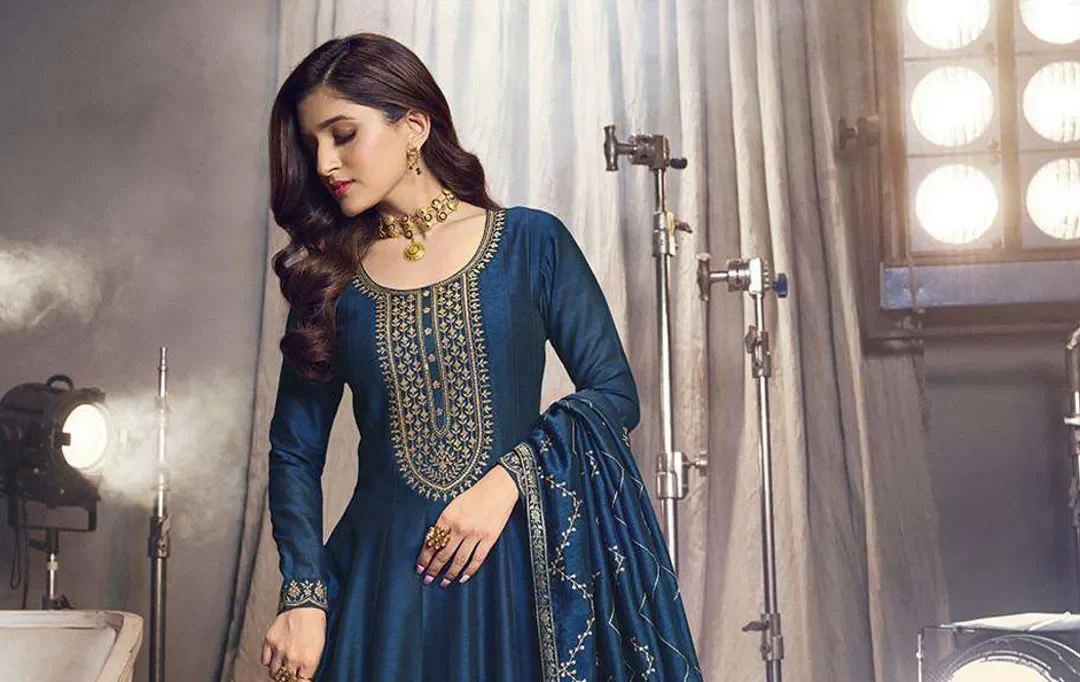 Salwar Kameez fashion trends showcasing elegant designs with modern cuts, vibrant colors, intricate embroidery, and stylish pairings like palazzos and dhoti pants for a contemporary ethnic look.(alt)