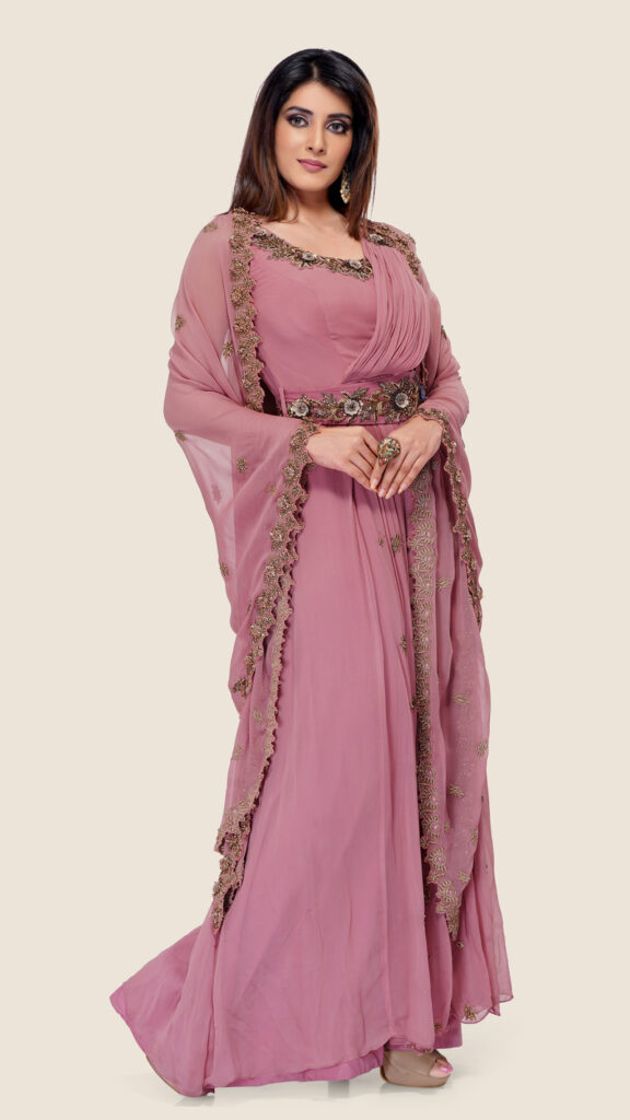 Saree-style gown with a cape and belt, featuring a flowing design and elegant draping.